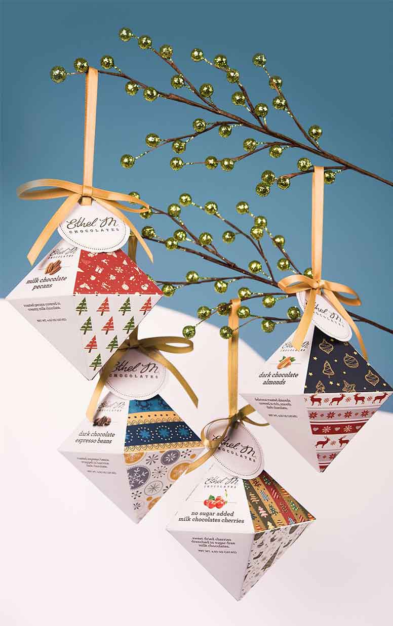Holiday packaging shaped like tree ornaments